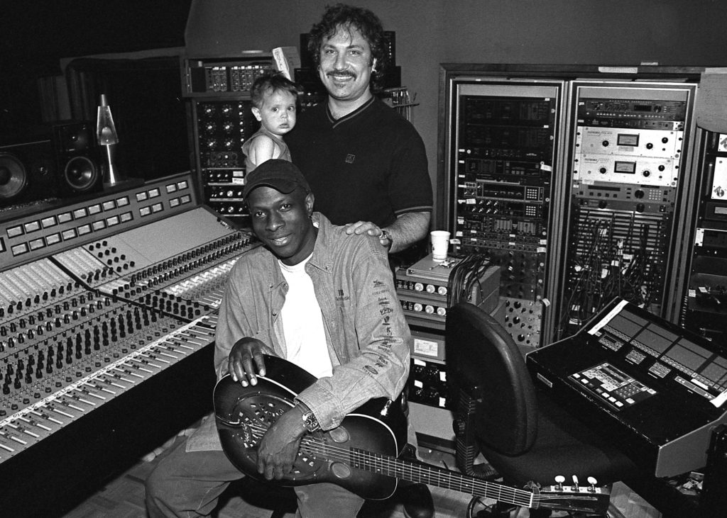 Keb’ Mo’ is seen in 1998 with Ross Hogarth and his son Brady in Studio B at United Recording, and again in 2021. Photos by David Goggin.